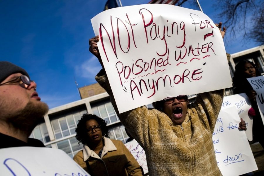 Citizens+stand+in+protest+during+a+Flint+Water+strike.