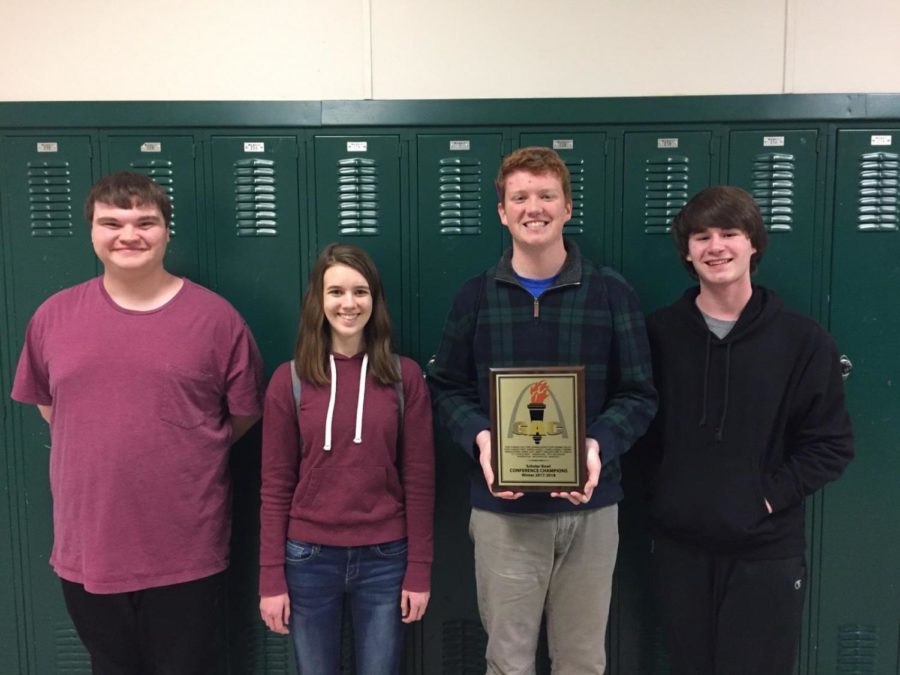 The WHS Scholar Bowl A team poses with their trophy Feb. 10, 2018. “It was awesome. I think for me the biggest thing I want to continue is the legacy that the guys before me did, senior Jonathan Amlong said. Doing that is a step to fulfilling that. This is WHS Scholar Bowls third consecutive win.