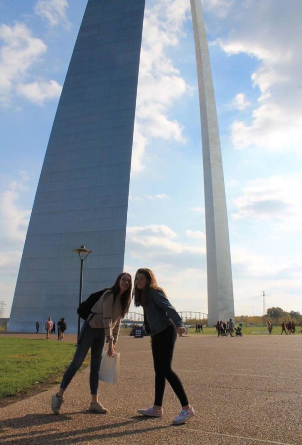 Lyllian Neuberger and French exchange student Louise Treuil pose in front of the St. Louis Arch. The United States is very different from France. Everything is bigger here, said Treuil. 