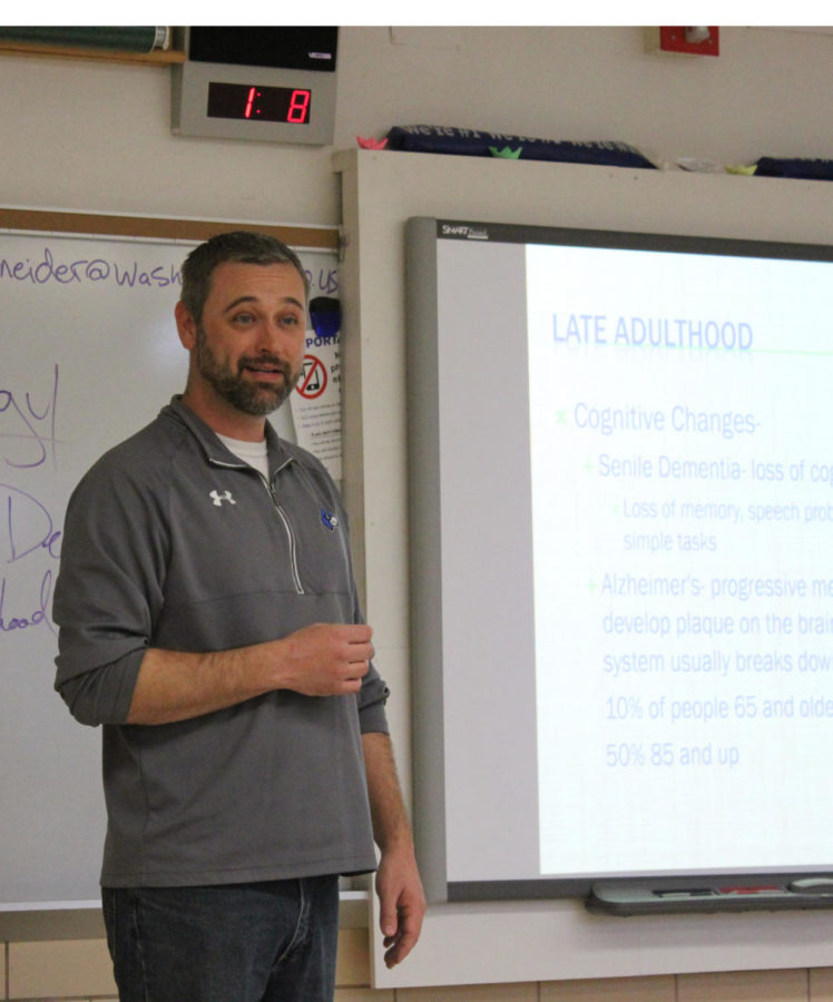 Clint Schneider teaches during his sixth-hour Psychology class.