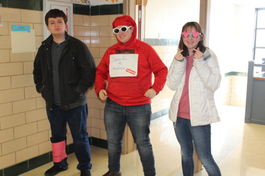 (Left to Right) Freshmen Ethan Upchurch dresses as a can of Cranberry Sprite, Frank Emma dresses as PEW NEWS and Cecelia Heimos dresses as Gin from BTS.