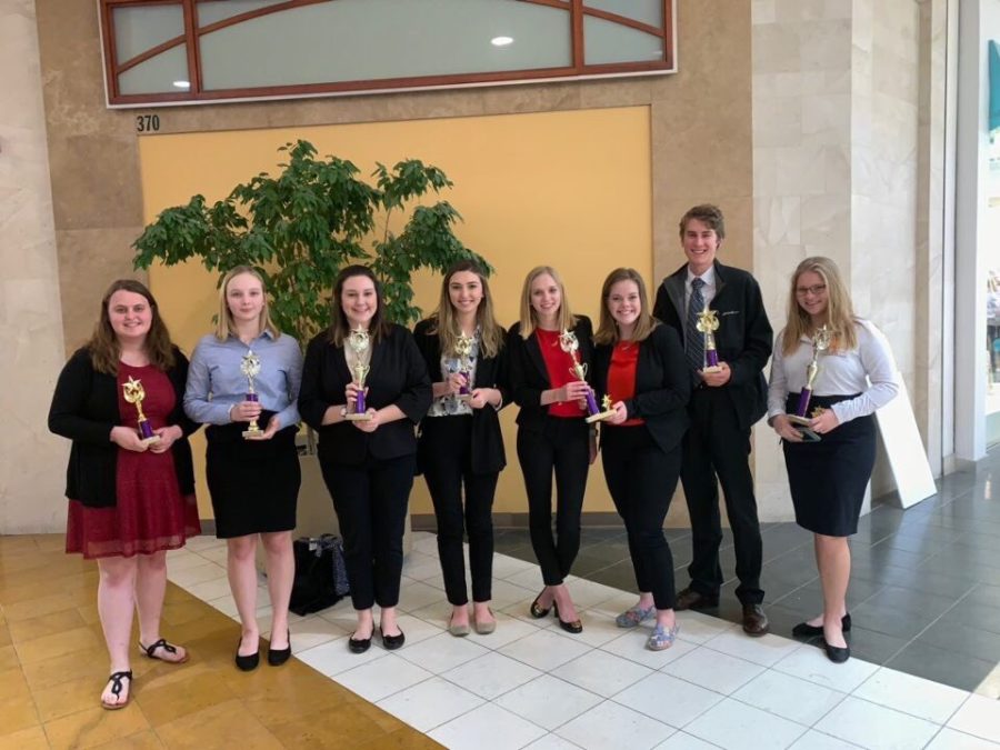 WHS DECA students pose with their awards at the district competition Feb. 6. “It’s really cool to be able to go [to state] and see everybody you’re competing against and all the organizations that they helped,” senior Sophie Hellebusch said. Hellebusch plans to attend the University of Nebraska next year as a business major.
