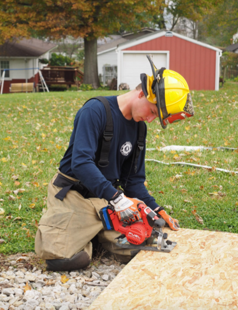 Junior Sam Backhaus cuts a gusset for support in a collapse drill where a car drove into a home. Backhaus has completed many rounds of firefighting training and has had a fair amount of experiences going on calls.
“ I have my state certified Basic Firefighting Degree,” Backhaus said, “through the State Fire Marshall Office.”
