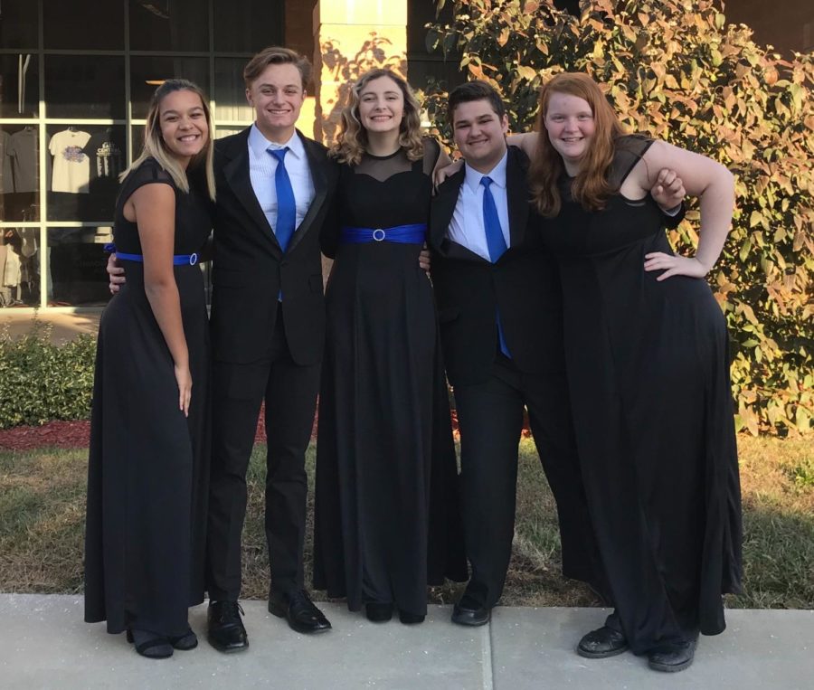 WHS choir students Kayla Childs, Levi Weber, Morgan Sprehe, Evan Courtaway and Elizabeth Brennecke pose for a group photo at All District Choir. “You make connections with people from around the area and it’s really nice,” Sprehe said. “You get to be a part of something that you love doing, but on a bigger scale than just at school.” Last year, four students from WHS participated in All District Choir.