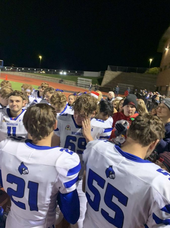 Emotions run high as the football Jays huddle up for the final singing of the school song after their game Friday, Nov. 5. “My favorite memory was singing the school song on the track with all my friends right next to me for the last time,” senior student section leader Ingrid Figas said. Washington fell 49-6 against Helias Catholic in the second round of district play.