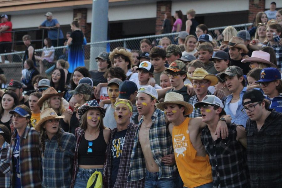 The Flock leaders (front) cheer on the Washington Blue Jay Varsity football team against Holt for Hick Night on September 8th, 2022. We all come up with [theme] ideas that havent really been done before, said Inman.