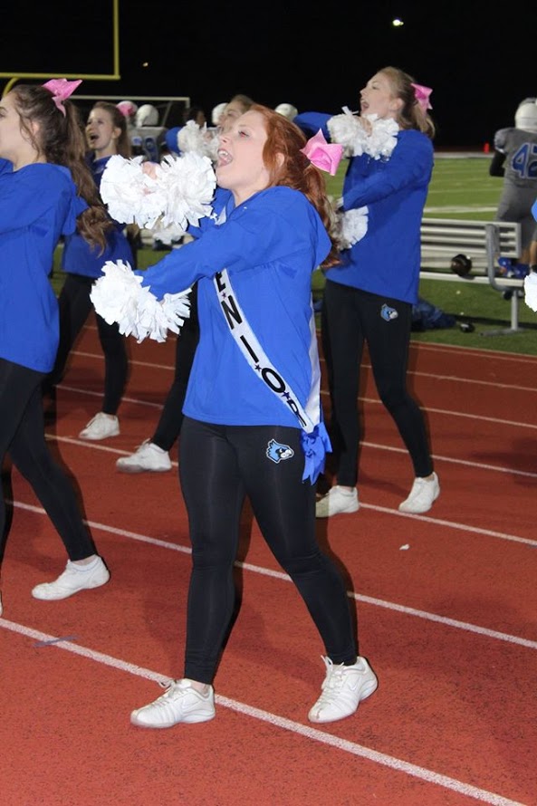 Senior cheerleader Emily Groppe cheers on the sideline at the Oct. 14 football game.  "I love my [cheer] team. They are all like a family to me," Groppe said.
The Washington Blue Jays lost the football game on Senior Night. 