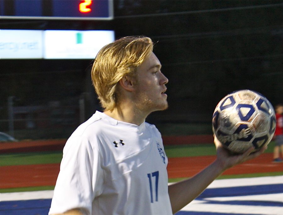 Senior Ian Yenzer prepares to throw-in the ball back into play. “I thought I had a personally good individual season, the way I played and communicated with my teammates to clear up our backfield to get the ball up the field,” Yenzer said. The Blue Jays finished their season 13-15 and won the district championship.