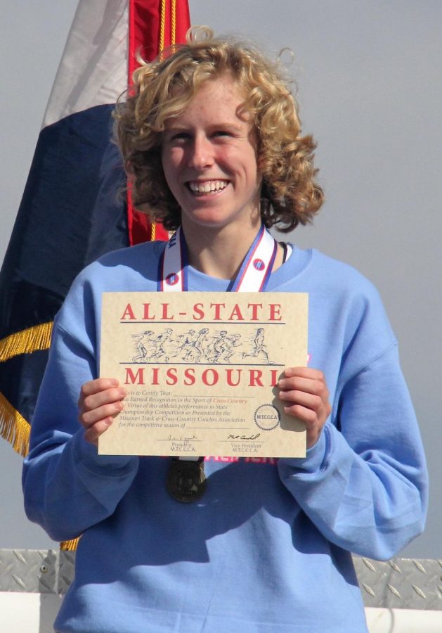 Junior Mikayla Reed accepts her All-State Missouri title for cross-country. “There are no words to describe what I felt after I crossed the finish line, knowing I had won State,” Reed said. Reed beat the second place finisher by 25 seconds.