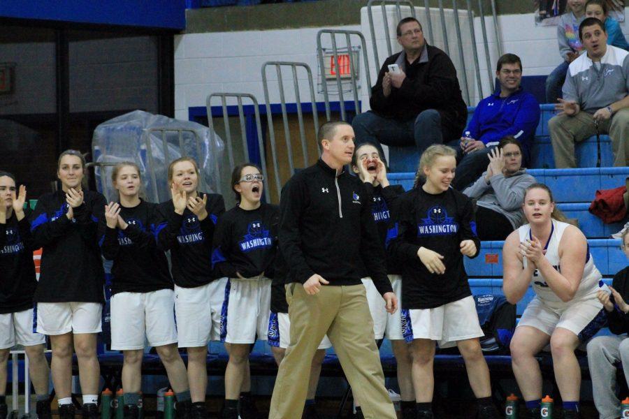 Coach Fischer stands along the sideline at a game against Ursuline Academy. "Our number one goal is to work hard every day," FIscher said. The Blue Jays are 19-3 this season. 