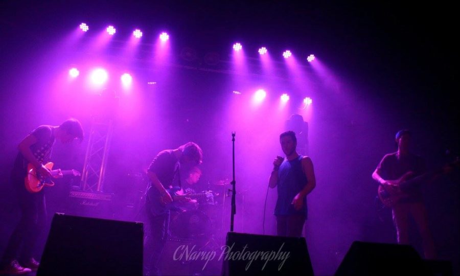 The Volunteers perform live at the Pop's concert venue.