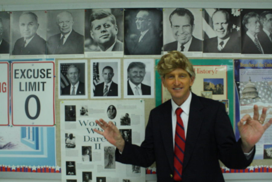 Social studies teacher Ed Stahl poses in his President Trump costume on Halloween.