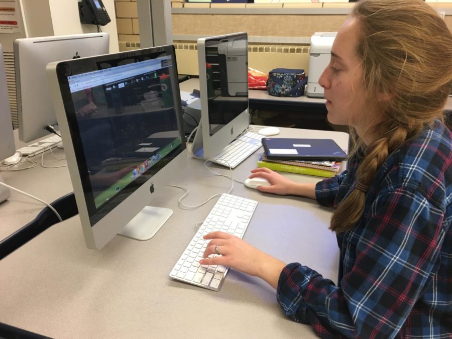 Senior Lydia Juengling works on her yearbook spread Monday, Nov. 27, 2017. "It teaches me a lot of really good life skills," Juengling said. In the future, Juengling wants to take what she's learned in high school and apply that towards a degree in architecture.