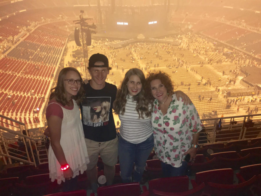 Madilynn Kipp poses with family friends before the Reputation Stadium Tour in St. Louis, Tuesday, Sept. 18.