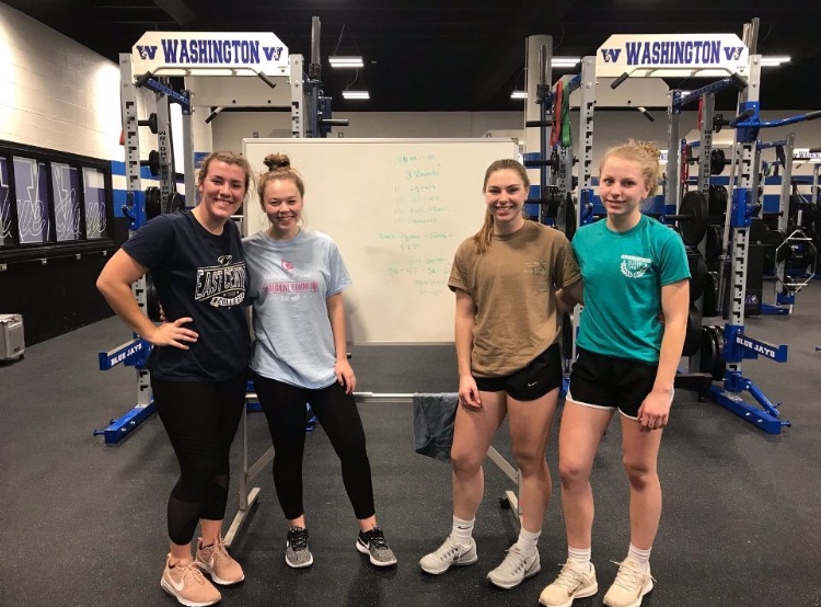 Swim team members McKenzie Dohm, Brooklin Voss, Clairese Kluba and Jacqueline Kluba pose for a photo before their workout led by Samantha Loepker after school Nov. 19. "The swimmers that we have are really good," Moreland said. "So overall I think we will do a lot better last year." The girls first meet was Wednesday, Nov. 28.