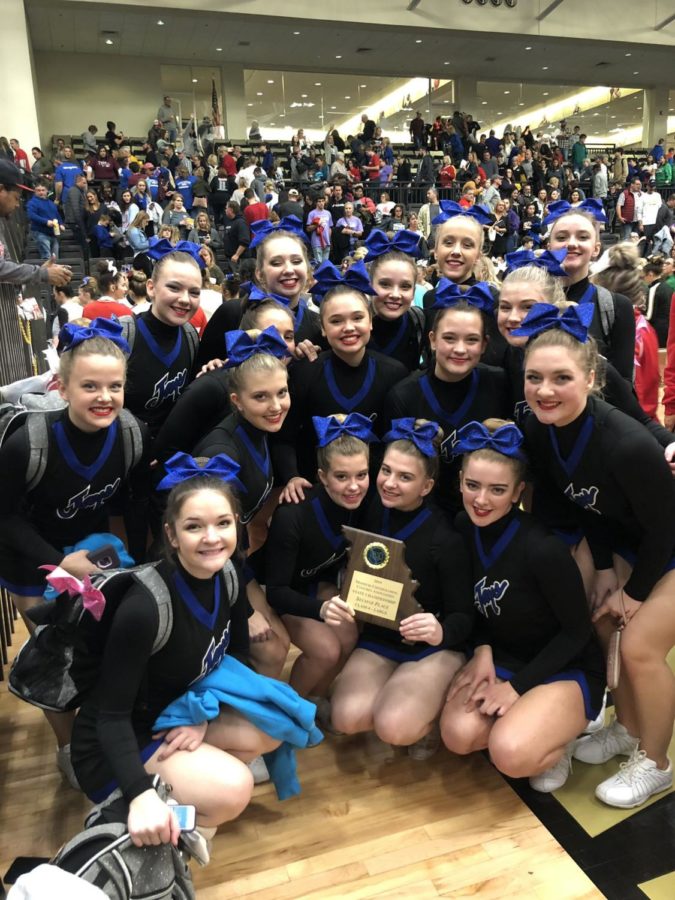 The WHS cheer team takes a group photo after performing at the state competition at Lindenwood University. "I think that, speaking for all of the seniors, it feels absolutely amazing [to have done so good at state]," Paige Whittall said. "I think that this is all that we could have asked for ending our senior competition season.” The team will be cheering at Saint Francis Borgia Regional High School for the WHS basketball team's Turkey Tournament on Nov. 26.
