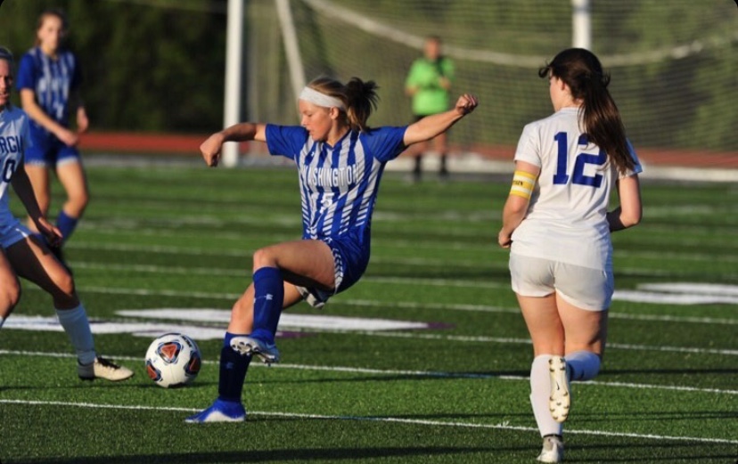 Senior Sarah Becszlko goes for the ball during her last year as a Blue Jay. “I don’t think I’ll ever forget warming up before a game,” Becszlko said. “Just singing and dancing while we stretched and got a few touches on the ball while JV played, and just cheering JV on, screaming at the top of our lungs when they scored.” Becszlko does what she can at home to stay in shape, including running and playing soccer with her brother. 