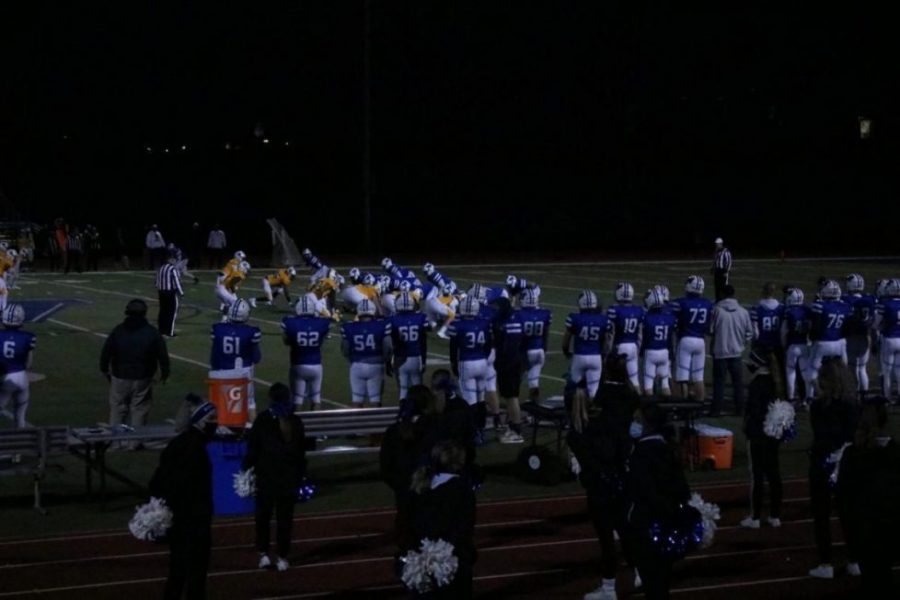 The Washington football team lines up for a play in the championship versus Battle. "We are all very excited about last week, but we have to focus on this week," junior Cam Millheiser said before the game. Washington would end up losing this game 27-7.