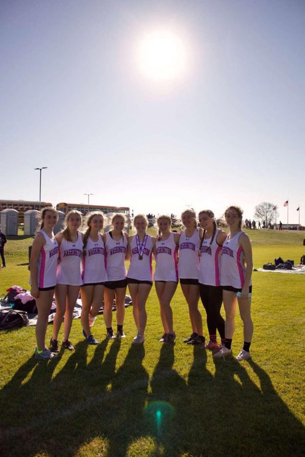 The girls cross-country team poses for a picture at the state competition in Columbia, MO, on Nov. 7, 2020.