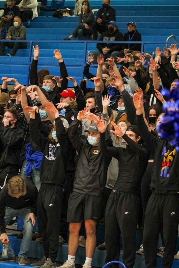 Students cheer on the basketball team earlier this season.