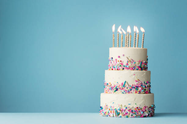 Birthday cake with three tiers and colorful sprinkles